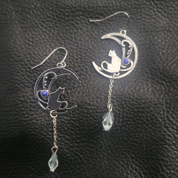 Cat sitting on crescent moon blue & silver tone dangle hook earrings - Picture 1 of 2